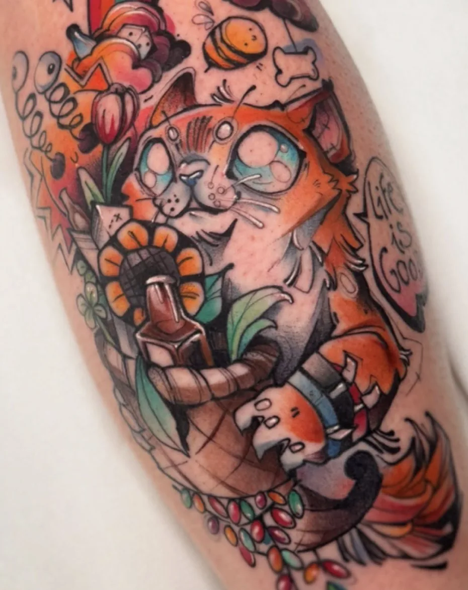 Illustrative cartoon cat tattoo on the calf