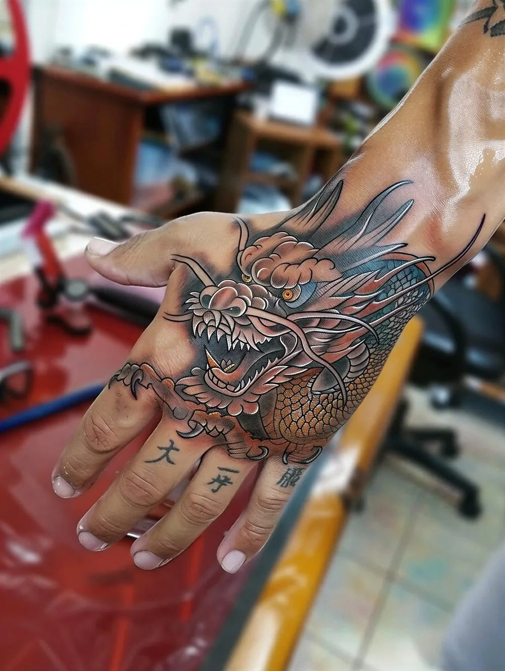 Japanese dragon tattoo on the back of the hand