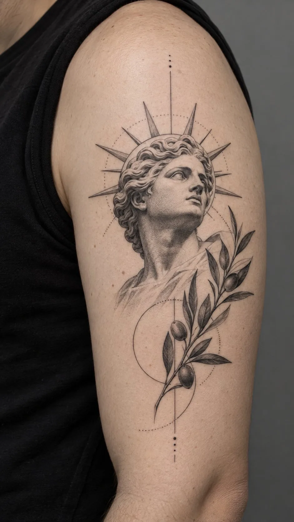 Realistic Greek statue and olive branch tattoo on the upper arm
